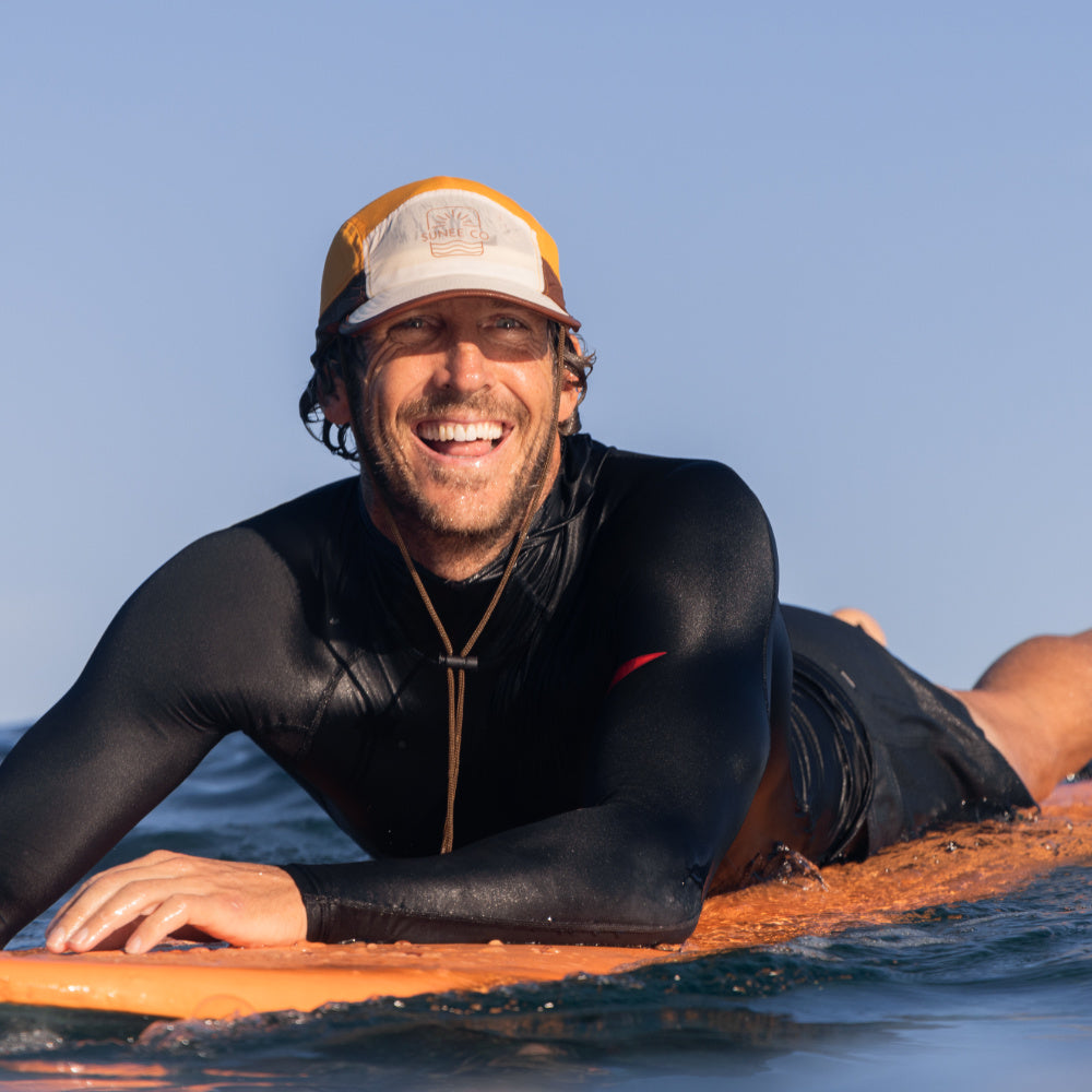 Close-up of chin strap and toggle on secure surf hat